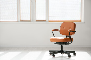 Office brown chair near window in room