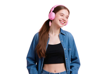 A young woman with pink headphones on, wearing a denim shirt and black top, smiling happily in a relaxed manner.