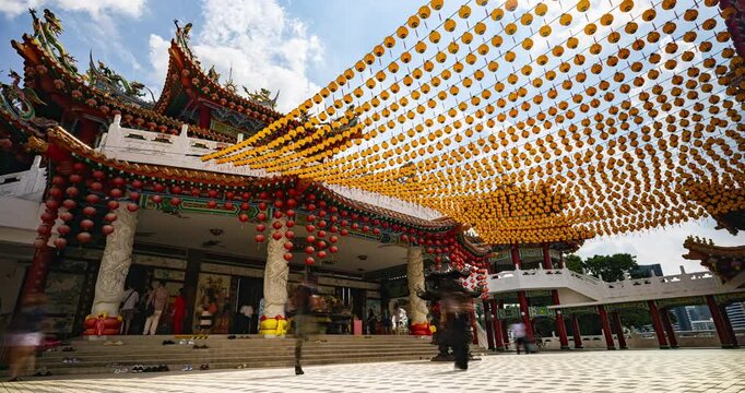 Kuala Lumpur, Malaysia &ndash; October 13, 2025: Time lapse of Thean Hou Temple courtyard decorated with hundreds of lanterns, visitors walking and clouds moving above