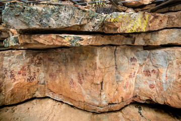 Cultural tourism - Schematic ancient rock art in Spain. Anthropomorphic figures stand out in this...
