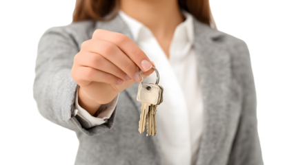 A woman holds out the keys to a new apartment.