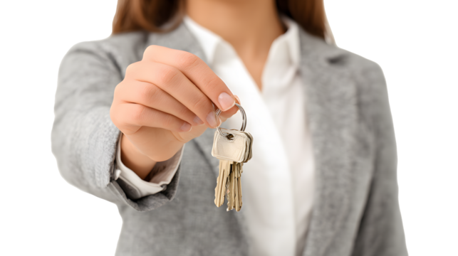 A woman holds out the keys to a new apartment.