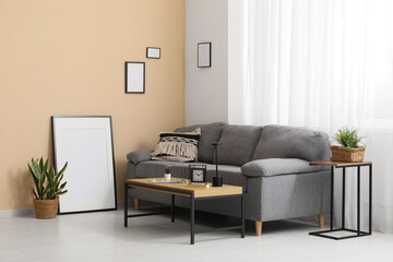 Coffee table and sofa in interior of living room