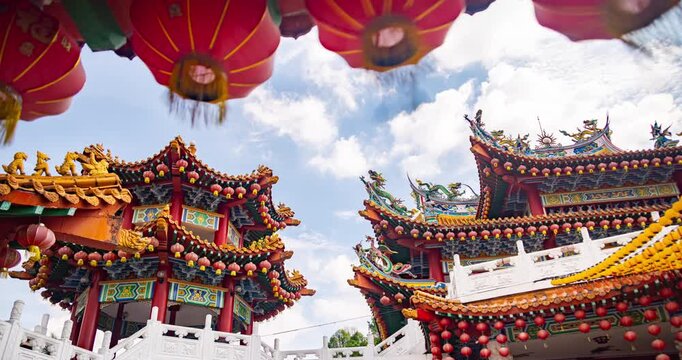 Kuala Lumpur, Malaysia &ndash; October 13, 2025: Time lapse of Thean Hou Temple courtyard decorated with hundreds of lanterns, visitors walking and clouds moving above