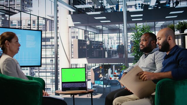 Goal oriented professionals participating in a meeting with copy space display, focusing on global development combined with leadership skills. Research and business insights. Camera A.