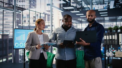 Diverse business CEOs meeting to discuss a new partnership between international firms, analyzing...