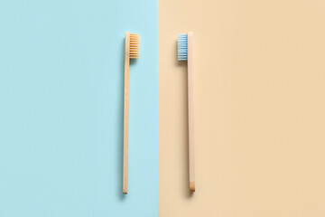Composition with wooden toothbrushes on color background, closeup