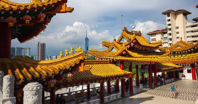 Kuala Lumpur, Malaysia &ndash; October 13, 2025: Time-lapse from Thean Hou Temple rooftops as lanterns sway and visitors move below, with Merdeka 118 prominent in the distant skyline