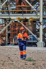 industrial drone pilot mapping and inspecting at a diamond mine metal structure from a plant