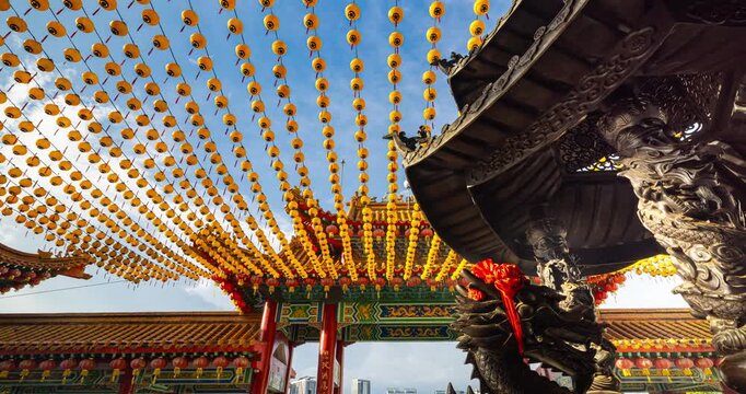 Kuala Lumpur, Malaysia &ndash; October 13, 2025: Time lapse of Thean Hou Temple courtyard decorated with hundreds of lanterns, visitors walking and clouds moving above