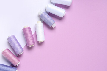 Thread spools on color background