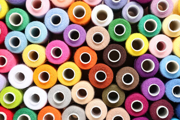 Many different thread spools as background