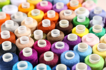 Many different thread spools as background