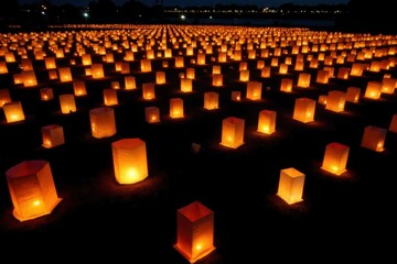 Obraz premium Milestone Anniversary Glowing Lanterns and Starry Night Sky A wide shot of a tranquil night sky filled with countless twinkling stars. Below the sky, several warm, glowing lanterns are suspended on