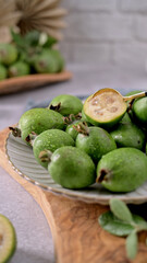 Fresh Feijoa Fruit on a Plate with a Golden Spoon