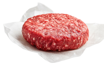 Raw beef patty on parchment paper (2)