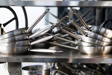 Stacked metal frying pans arranged in two stacks