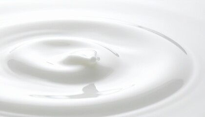 A close-up, abstract macro shot of a swirling white liquid, likely cream or milk, with soft, delicate ripples creating a beautiful, clean, and soothing visual