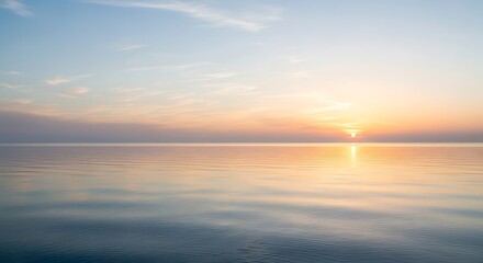Obraz premium Serene Sunset Over Calm Water Reflecting Golden Hues.