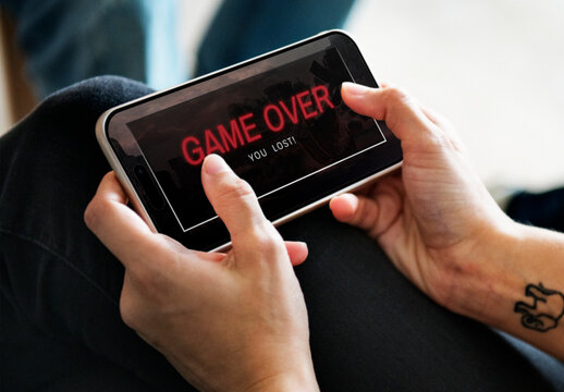 Closeup Of Man Playing Online Game On Mobile Phone Mockup