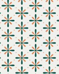 Simple geometric flower pattern in green and orange tones, creating a playful seamless background