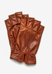 Obraz premium Beautiful leather fingerless gloves for driving on a white background