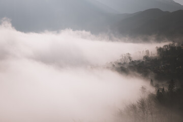 Foggy morning at Duoyishu scenic area, Yuanyang, Yunnan, China. Black and white, copy space for text
