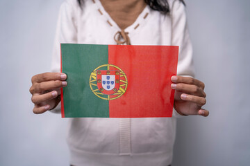 Person Holding the Flag of Portugal with Pride