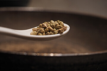 Cooking with spices in a rustic kitchen setting