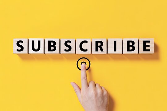 Hand presses the subscribe button with letters spelling subscribe on yellow background