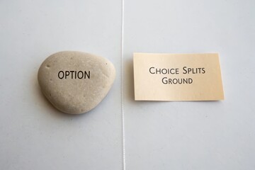 Flat lay showing option pebble and choice card divided by a line