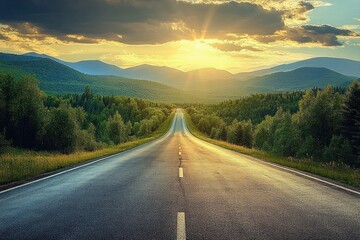 Long empty road stretching forward through dense green forest towards mountain range under dramatic cloudy sky with golden sunset light