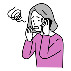 スマートフォンでの通話で困惑する年配の女性
