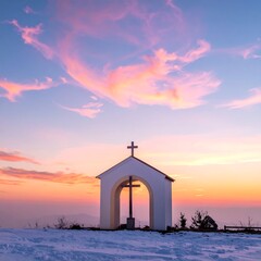 Fototapeta premium Serene mountain chapel silhouetted by a colorful sunset