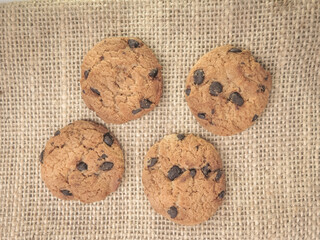 Chocolate Chip Cookies on Burlap Fabric Background