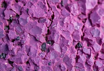 Close-up of rough, amethyst-hued stone surface, mineral, violet texture