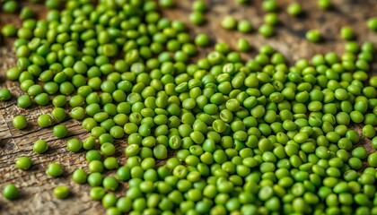 Close-up of vibrant green lentils scattered on a rustic wooden surface,   still life,   closeup