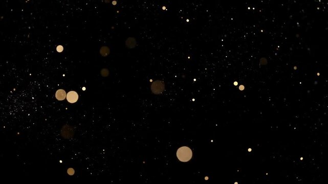 Abstract Golden Particles Floating in Black Background