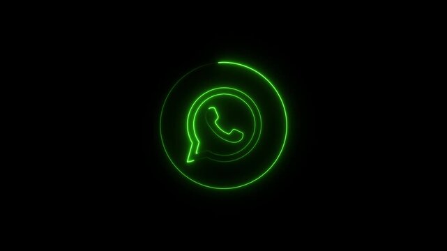 Green neon outline of Whats App logo with a speech bubble and phone icon on a black background whatsapp