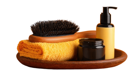 Wooden dish holding hairbrush, yellow towel, and beauty products