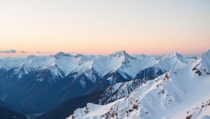 Alpine peaks dusted with fresh snow, bathed in golden sunrise light, conveying tranquility and rugged beauty. A wide, panoramic shot of rugged, snow covered mountain peaks bathed in the warm, golden
