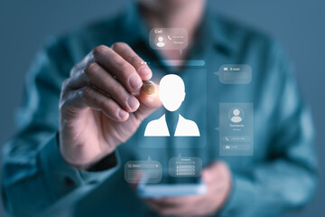 Professional using futuristic digital contact interface with virtual screen elements, symbolizing smart networking, communication, and digital identity in business
