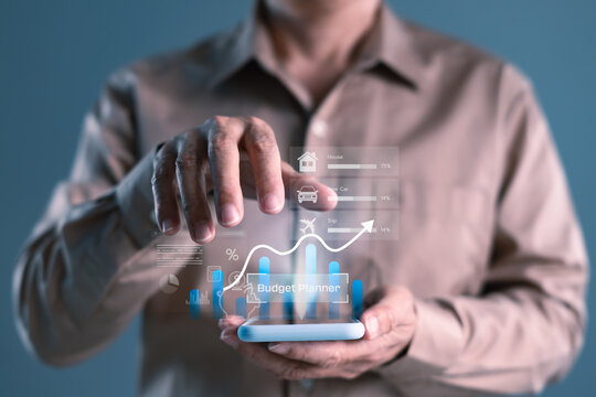 Man managing personal finances with smart budget planner app showing savings goals, expense tracking, and financial planning dashboard on virtual interface