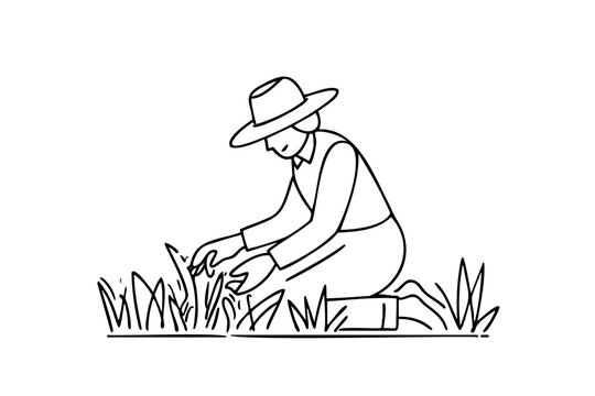 Woman is kneeling in a field and pulling weeds. She is wearing a hat and a shirt
