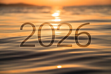 2026 New Year over a tranquil ocean sunset greeting