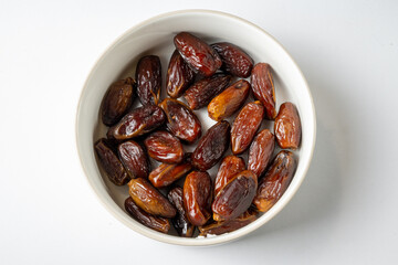 Bowl of dried dates - white background