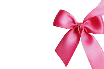 Pink ribbon bow on black background. Elegant gift detail