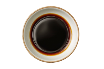 Top-down view of dark, viscous liquid in a round bowl