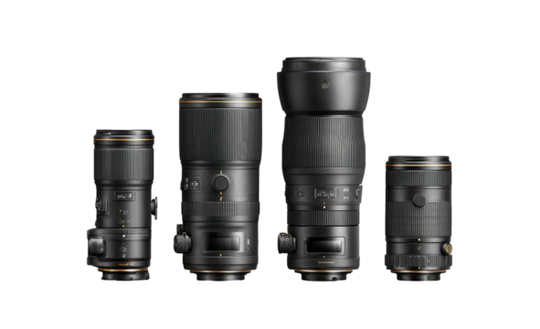 Four dark-colored camera lenses of varying sizes, lined up