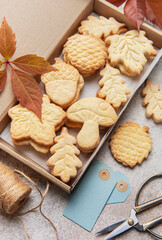 Fototapeta premium Autumn shaped cookies baking in cardboard gift box